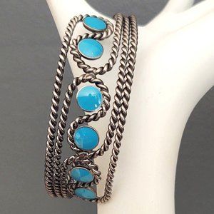 Dark gray textured metal cuff w/blue resin detail
